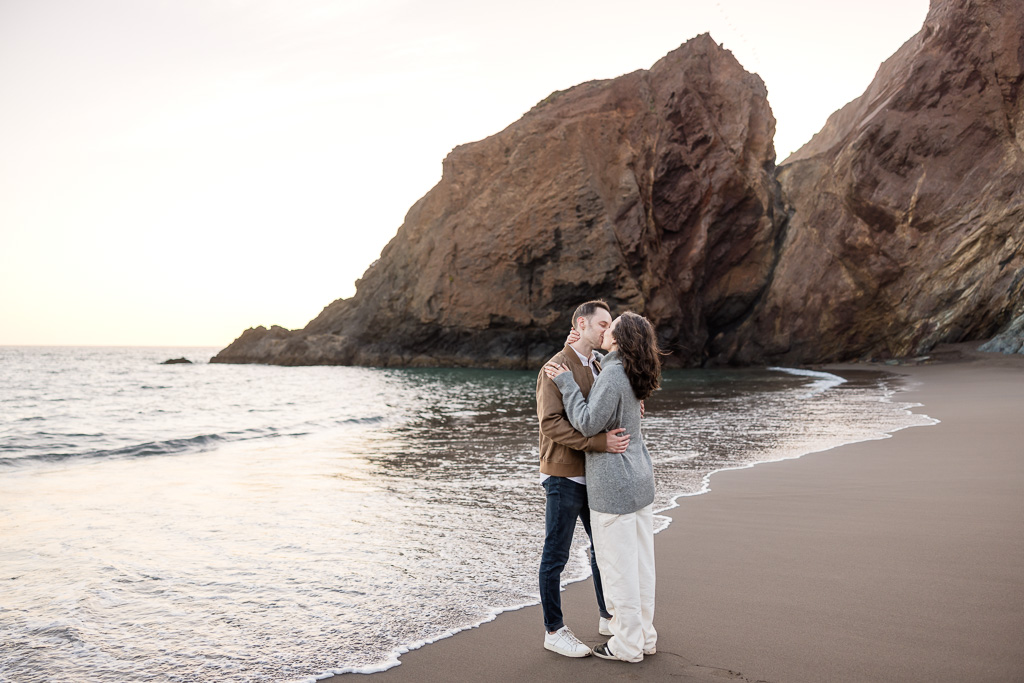 kiss on the beach at sunset